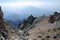 Brown rock on the background of the panorama of mountains of Tien Shan