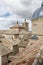 Brown roofs and tiles under the cloudy sky in Toledo