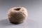 Brown rope roll, skein of jute twine on grey background