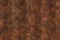 Brown rusty background. Old metal texture. Heavy burned metal surface. Abstract corrosion copper wall background.