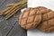 Brown rye circular flatbread with rye spikelets