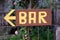 Brown sign with yellow writing â€žBARâ€œ