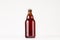 Brown steinie belgian beer bottle 330ml mock up. Template for advertising, design, branding identity on white wood table.