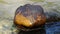 Brown stone, leaf texture, with brown luster throughout the river. Background picture.