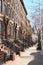 Brown stone row houses with high stoops in Harlem