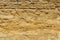 Brown stone texture background, limestone, wall texture, Old brown gold stone wall, stone wall, abstract view, exterior.