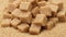 Brown sugar cubes over sugar rotation