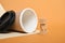 brown sugar cubes and thermo mug made of cork on a beige and brown background