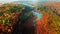 Brown swamps and river in autumn, view from above