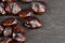 brown tamarind seeds on the table, scattered seeds