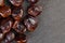 brown tamarind seeds on the table, scattered seeds