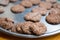 Brown tasty chocolate cookies with crackles lay at salver.