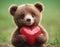 Brown Teddy Bear Holding Red Heart - Gift Of Love for Someone Special. An adorable brown teddy bear grasping a red heart