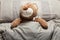Brown teddy bear laying in bed, furry doll. Sweet sleep
