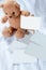Brown teddy bear photo stand enter text