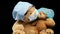 Brown teddy bear sits in protective plastic glasses, a medical disposable mask and a blue cap, concept of pediatrics