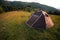Brown tent with quick installation system. Standing in the rays of the sun on the top of the mountain. Summer, rest, camping. Copy
