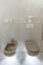 Brown toilet and bidet. Economic toilet white flush press with two separate buttons for flushing toilet. Bottom light. Shelf with