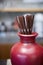 Brown tube in the ceramic red vase