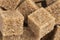 Brown unrefined cane sugar cube texture background. Macro shot refined sugar cube texture pattern