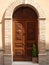 Brown varnish wooden door in an old Italian house.