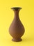 Brown vases on yellow