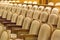 Brown vintage seats armchairs in theater. Theater or conference room interior.