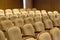 Brown vintage seats armchairs in theater. Theater or conference room interior.