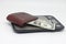 Brown wallet with banknotes on electronic kitchen scales. Symbol of accounting and family finance planning