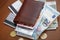 Brown wallet with euro money inside and coins, credit cards near