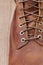 Brown waterproof leather mens boots with lacing . Close up view