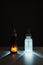 brown and white backlit face serum bottles