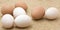 Brown and white chicken eggs.