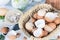 Brown and white eggshells placed in basket in home kitchen on table, eggshells stored for making natural fertilizers for growing v