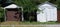 Brown and white old steel sheds or garages.