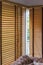 Brown wood curtain close mirror window