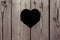 Brown wooden background with a heart. Vintage texture.