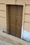Brown wooden door to the basement