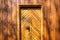 Brown wooden facade and doors of Polish highlander mountain style small chapel in Zywiec Beskid Mountains, Milowka, Poland