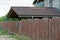 Brown wooden fence on a rural street