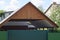 Brown wooden roof covering over a private courtyard