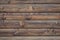 Brown wooden striped texture. Weathered planks, backgrounds. Dark timber. Rough surface. Dark board pattern, grunge fence.