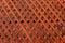 Brown wooden wall lattice background texture.  wooden fence cross pattern. Crossing a tree with nails