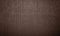 Brown wooden wall, planks, table, floor surface. Dark wood texture.