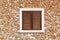 Brown wooden window in masonry wall