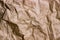 Brown wrinkle recycle paper background. Texture of crumpled paper. Texture of rumpled old paper close-up