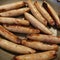 Browned sausage links in hot pan