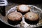 Browned sausage patties frying in frying pan