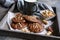 Brownie cookies topped with melted chocolate and chopped peanuts