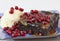 Brownie with ice cream and pomegranate
